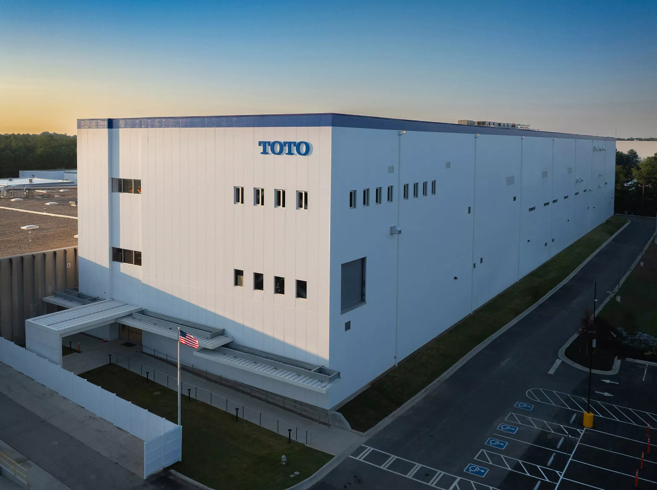 Exterior of TOTO’s new Morrow, GA, manufacturing facility, a three-story plant expanding U.S. luxury toilet production.