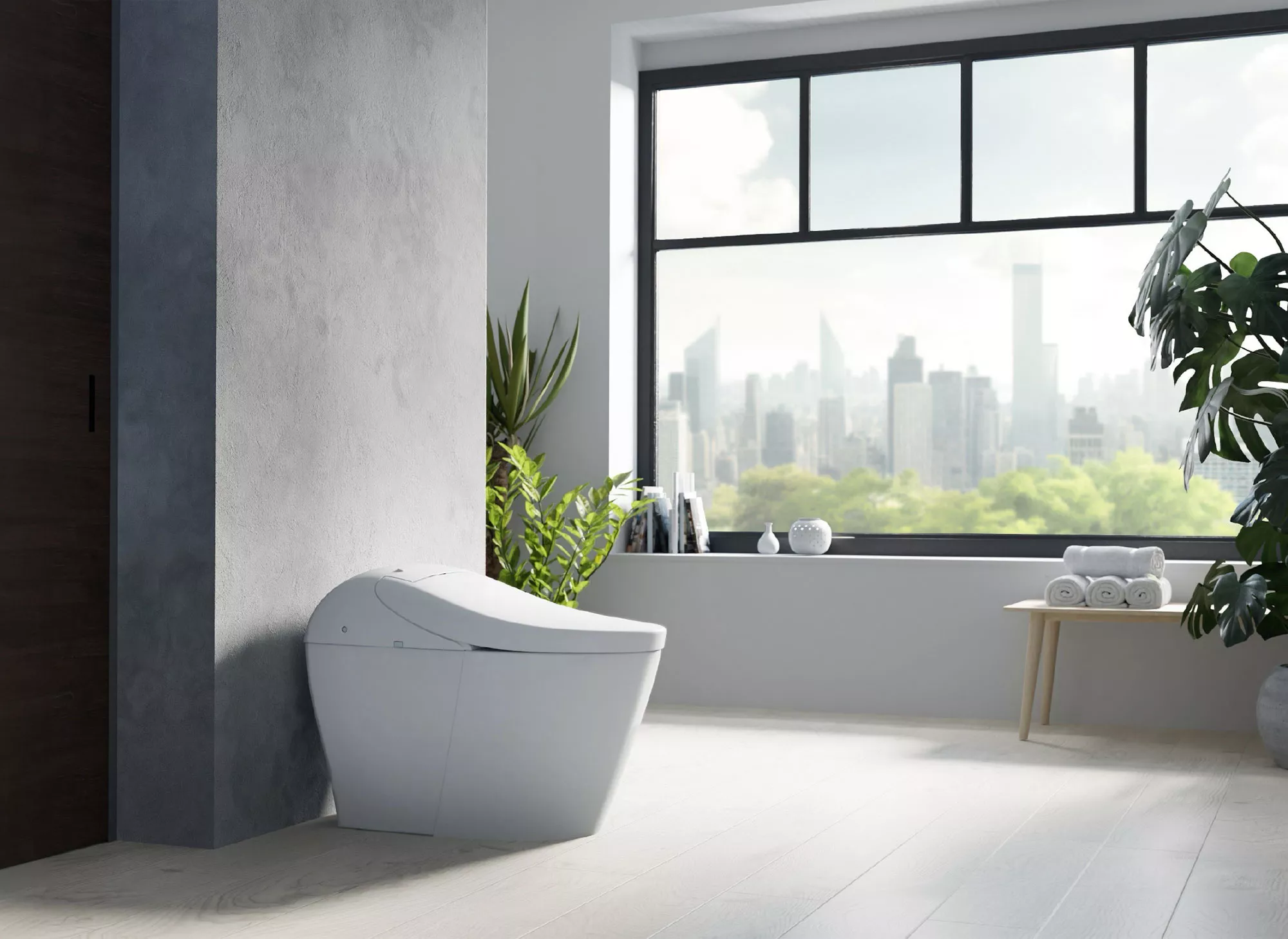 A WASHLET G5A smart toilet is displayed in a bright, modern bathroom with cityscape views and lush green plant accents.