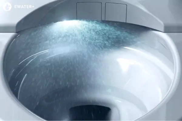 TOTO’s EWATER+ technology cleaning a toilet bowl with a spray of electrolyzed water