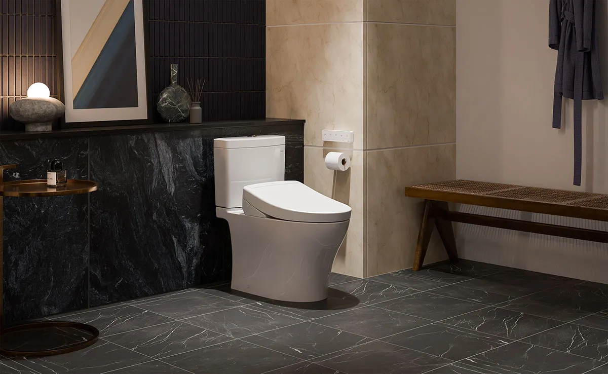 WASHLET S5 bidet seat from TOTO on Aquia IV Toilet in a modern spa-like bathroom with black marble walls and sleek design.