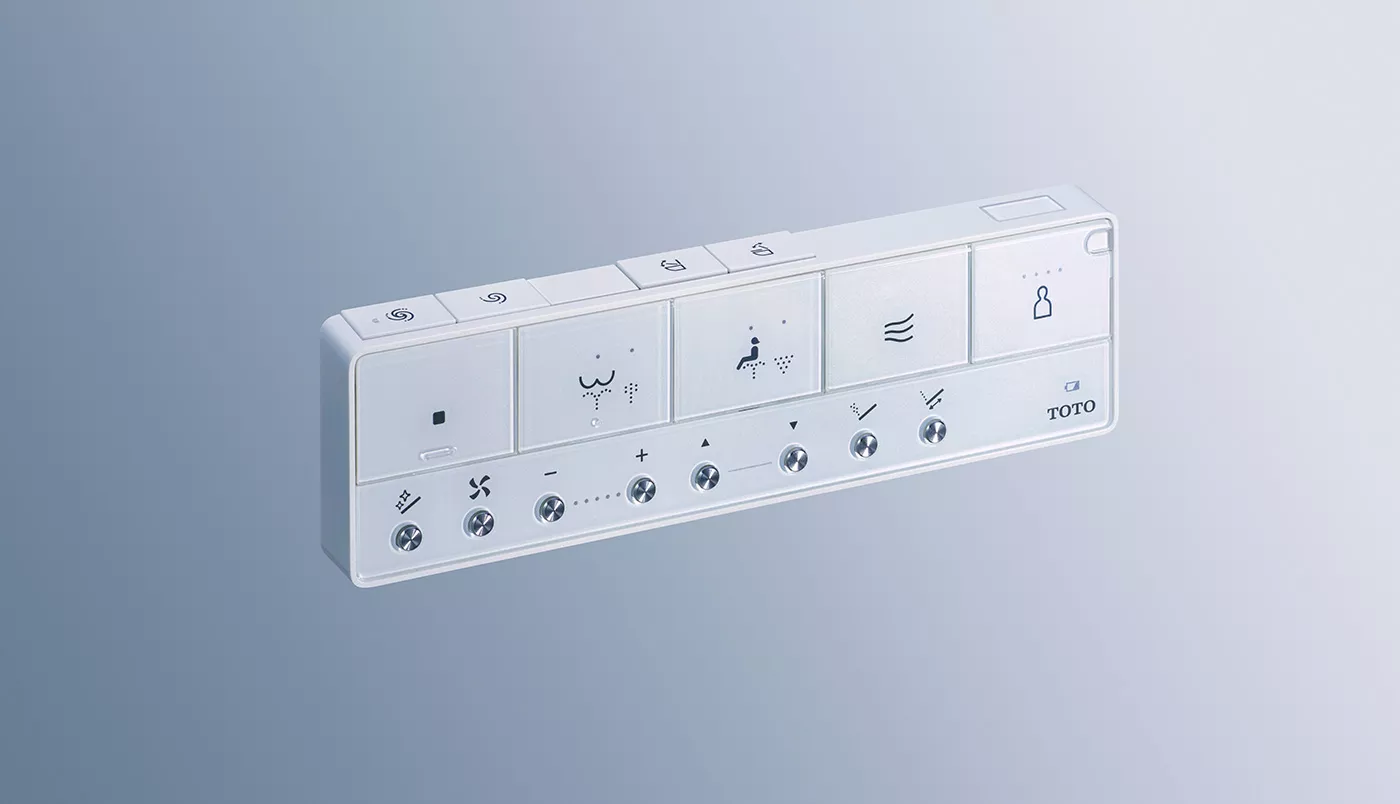The intuitive, pearl-white remote control for the TOTO WASHLET S7A features a sleek design and multiple function buttons.