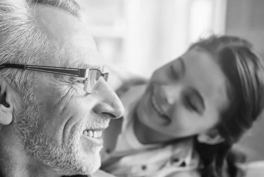 A smiling father and daughter 