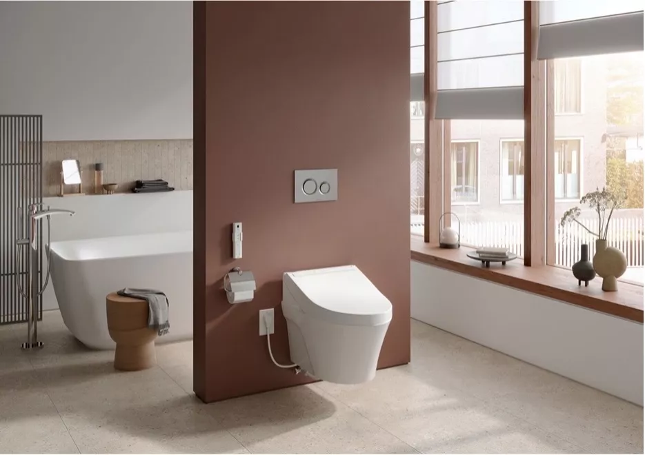 Spacious modern bathroom with a TOTO WASHLET C5 bidet seat, a freestanding bathtub, and large windows letting in natural light.