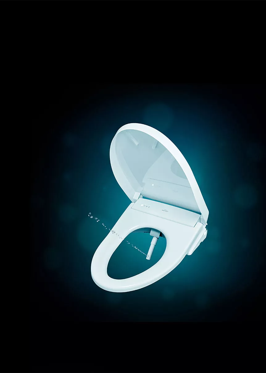 Close-up of a TOTO WASHLET S7A bidet seat with its wand extended, offering a spa-like clean for eco-friendly home upgrades.