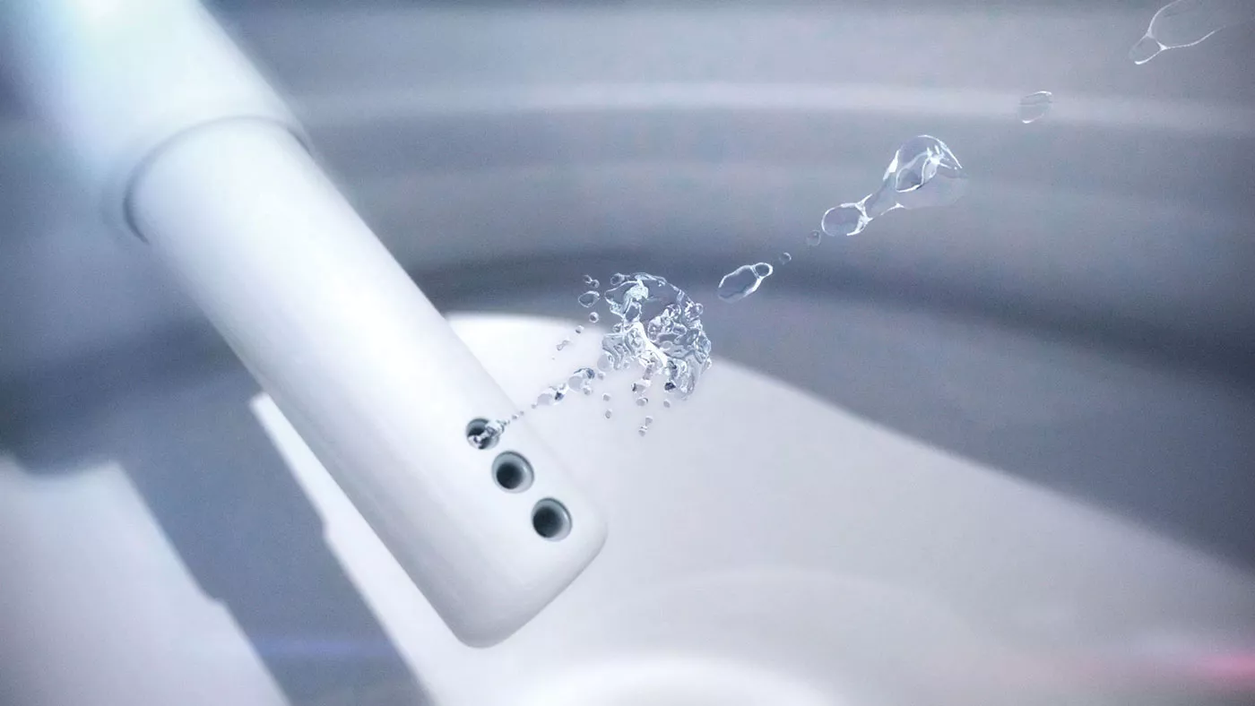 Close-up of a TOTO WASHLET wand spraying warm water, demonstrating its advanced Wonder Wave technology for effective cleansing.