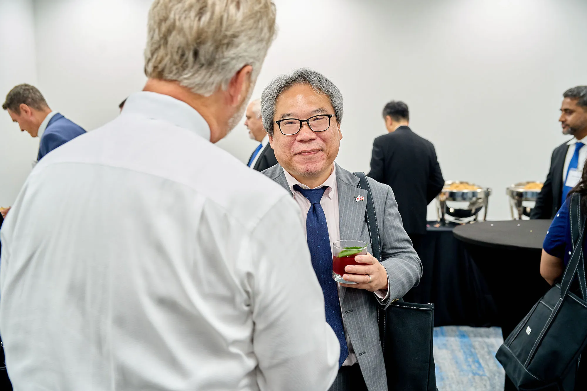 Bill Strang speaks with Consul General Mio Maeda during the post-ceremony reception at TOTO’s Morrow facility event.